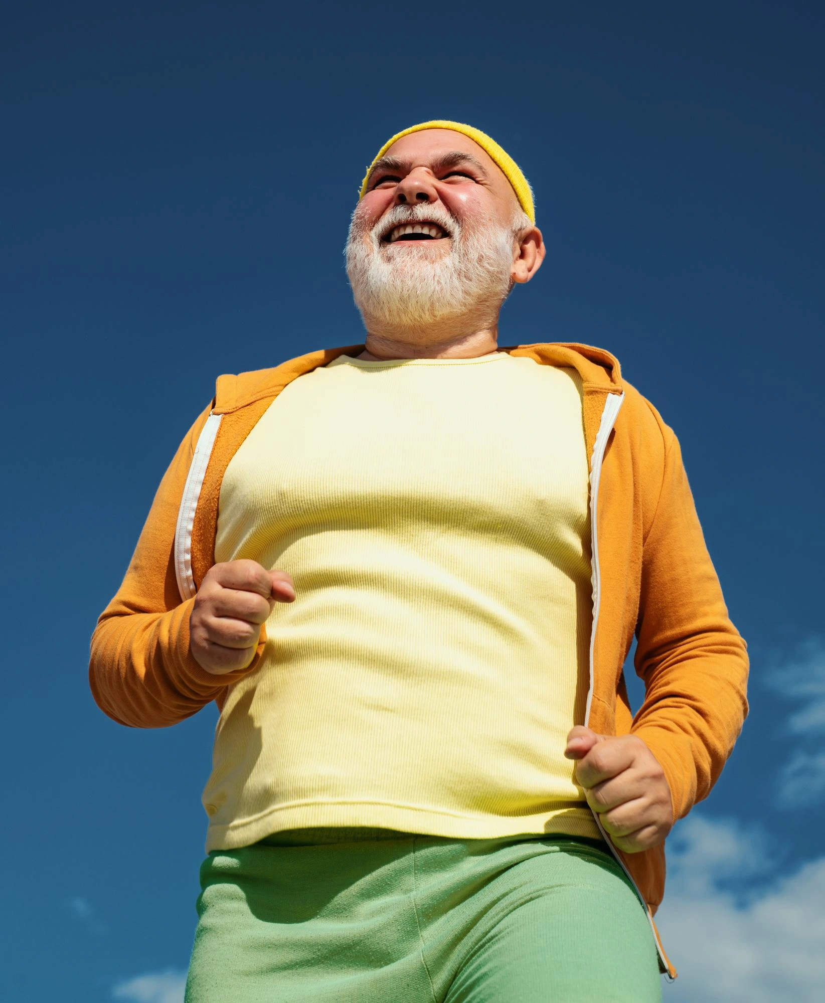 Older adult smiling outdoors representing vitality, metabolic health, energy, and healthy aging through The Sante Method.